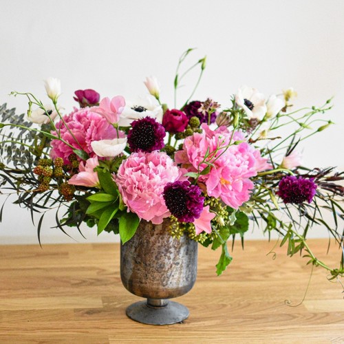 Pink peonies white anemones and dark scabiosa in a pewter urn by luxury floral design Cary